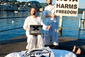 ACTAivists from Act Up-Paris & La Quadrature du Net in front of the place of the negociations.